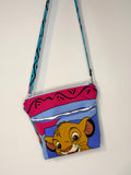 crossbody of little lion and warthog