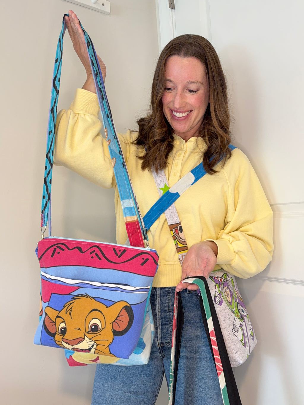 main character collective holding crossbody of little lion